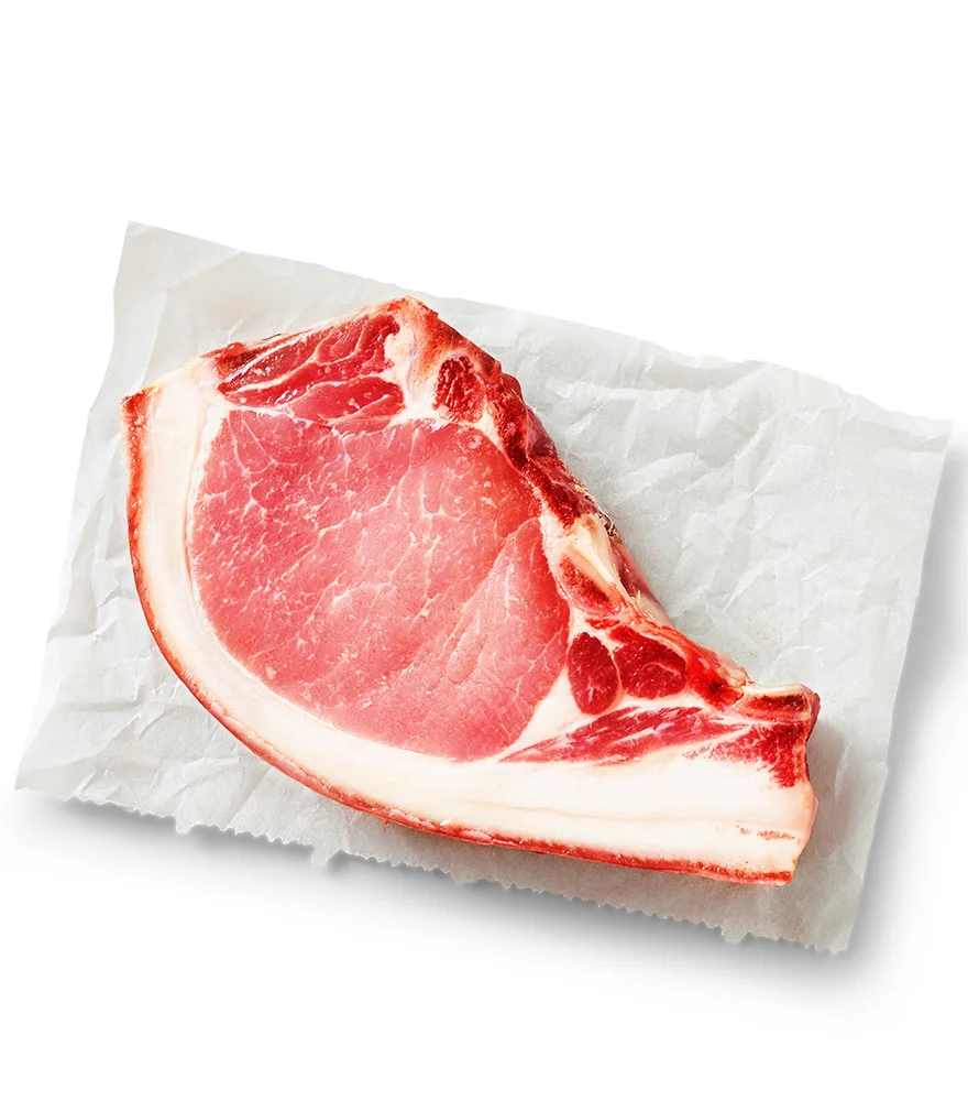 Raw meat on parchment paper with enhanced red color and higher contrast.