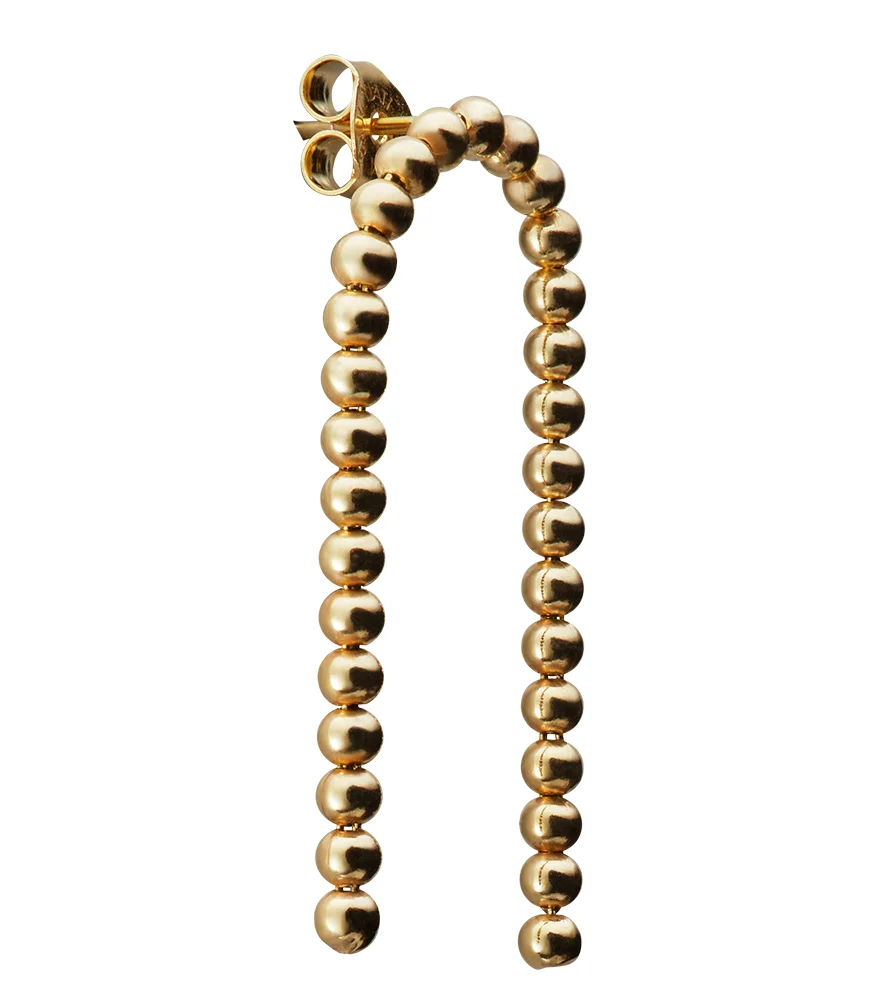 Isolated gold earring with enhanced shine, color, and reflection cleanup.