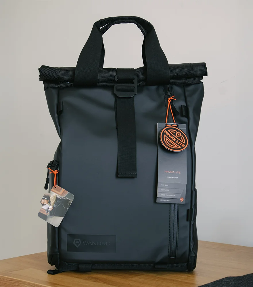 Unedited product image showing wooden table and background clutter.