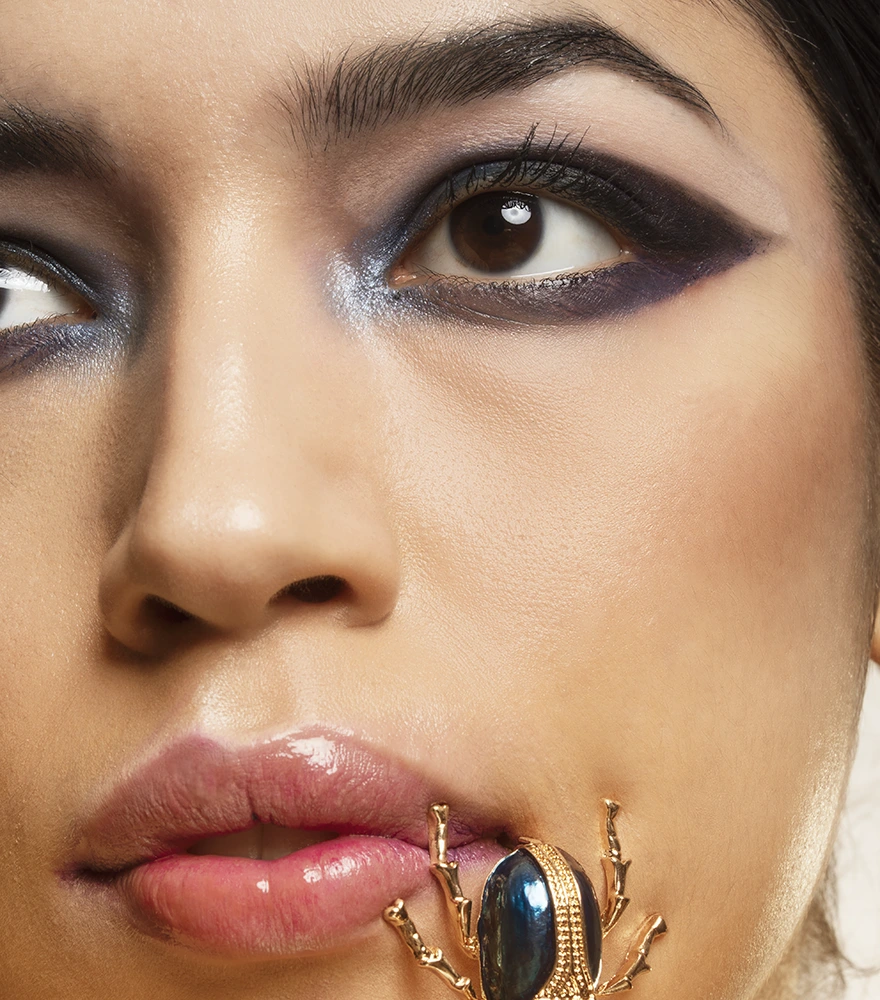 Close-up of a woman’s face with balanced skin tone and artistic makeup grading.