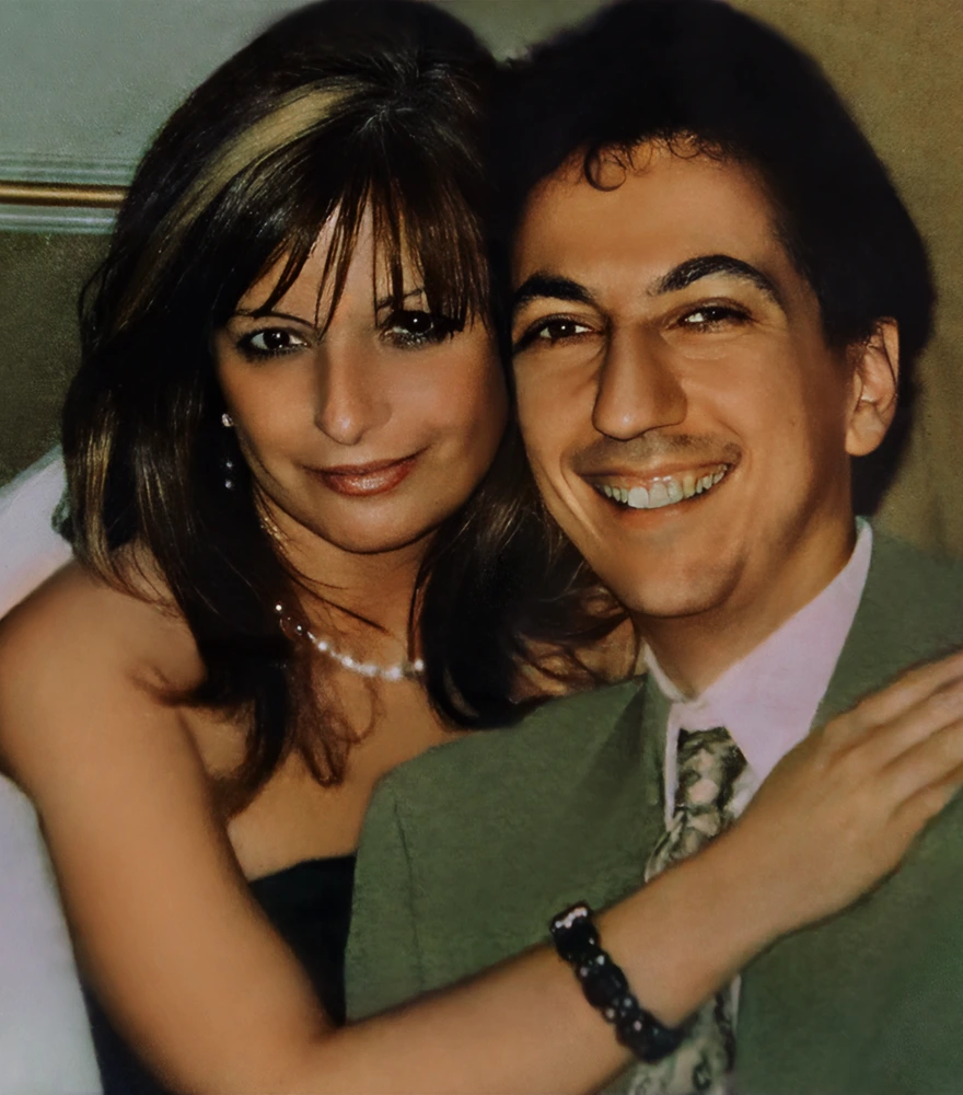 Restored and colorized portrait of a smiling couple with smooth finish.