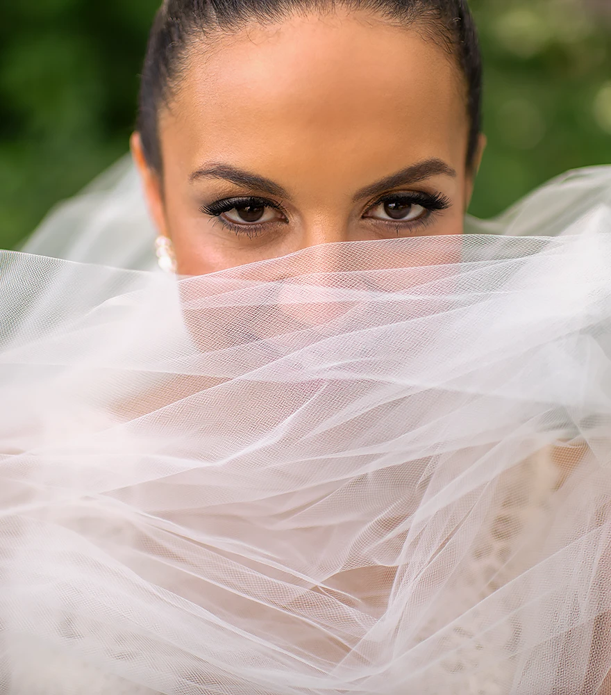 Close-up portrait of a bride with enhanced tones and cinematic mood.