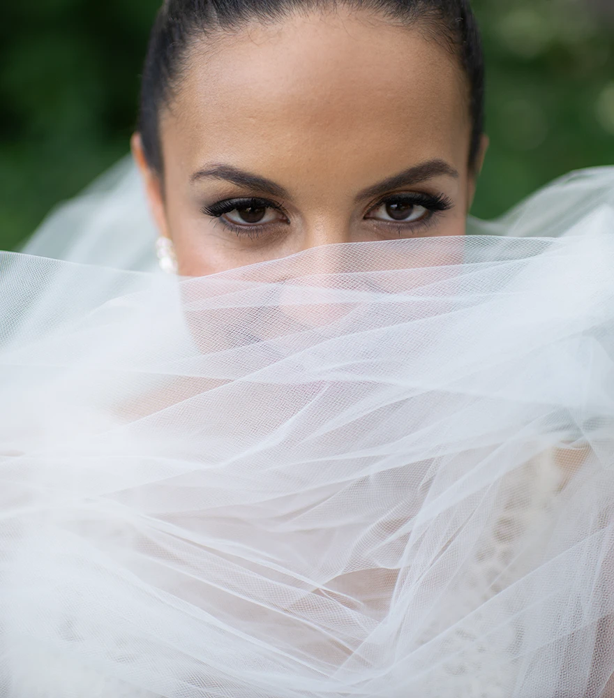 Raw bridal portrait with natural lighting and moderate colors.