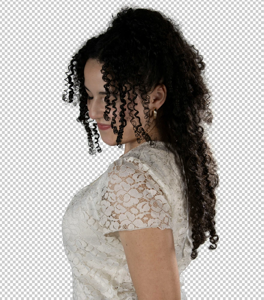 Woman with curly hair and lace dress precisely cut out using layer masking on transparent background.