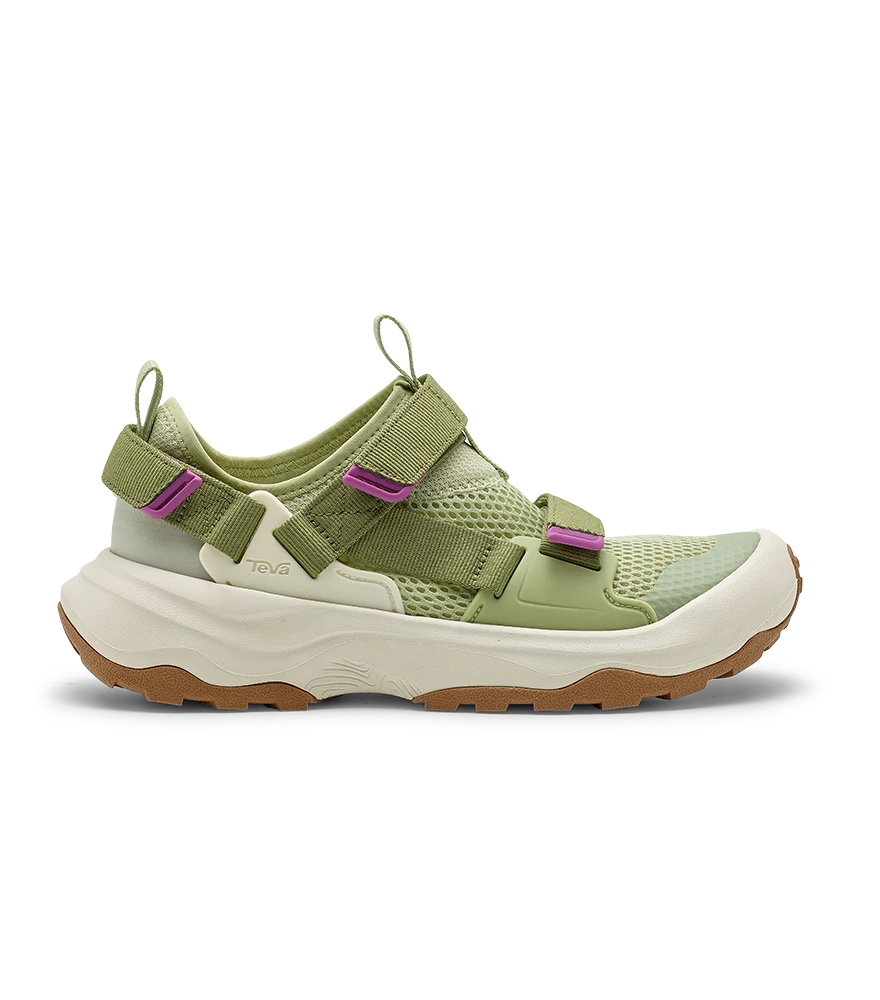 Green and white Teva sneaker with realistic natural shadow on white background.