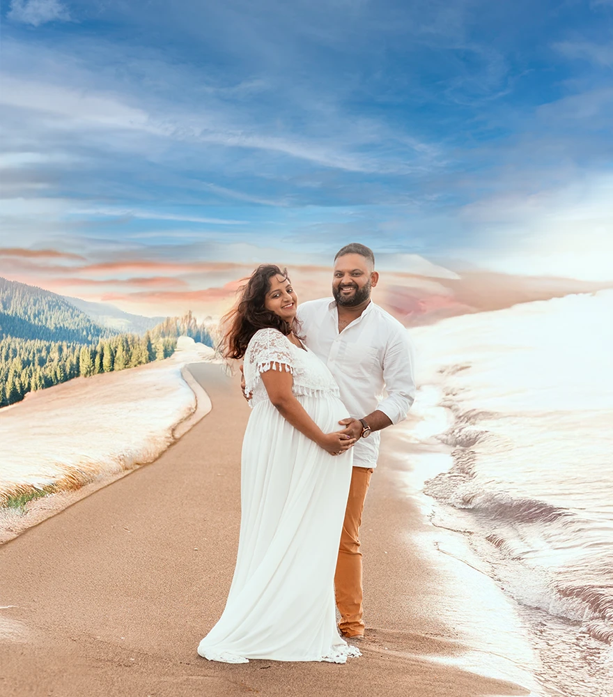 Dramatically enhanced maternity photo with artistic background blending beach, forest, and sky.