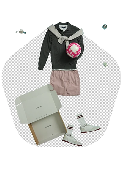 Flat lay of a sporty outfit including a dark sweater, pink skirt, shoes, and a pink ball.