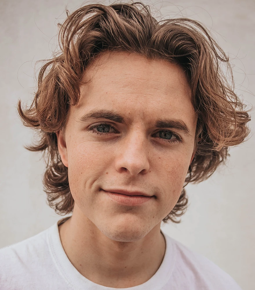 Basic Retouching (Clean & Natural Look)_Before Natural portrait of a young man with minor blemishes and uneven skin texture.