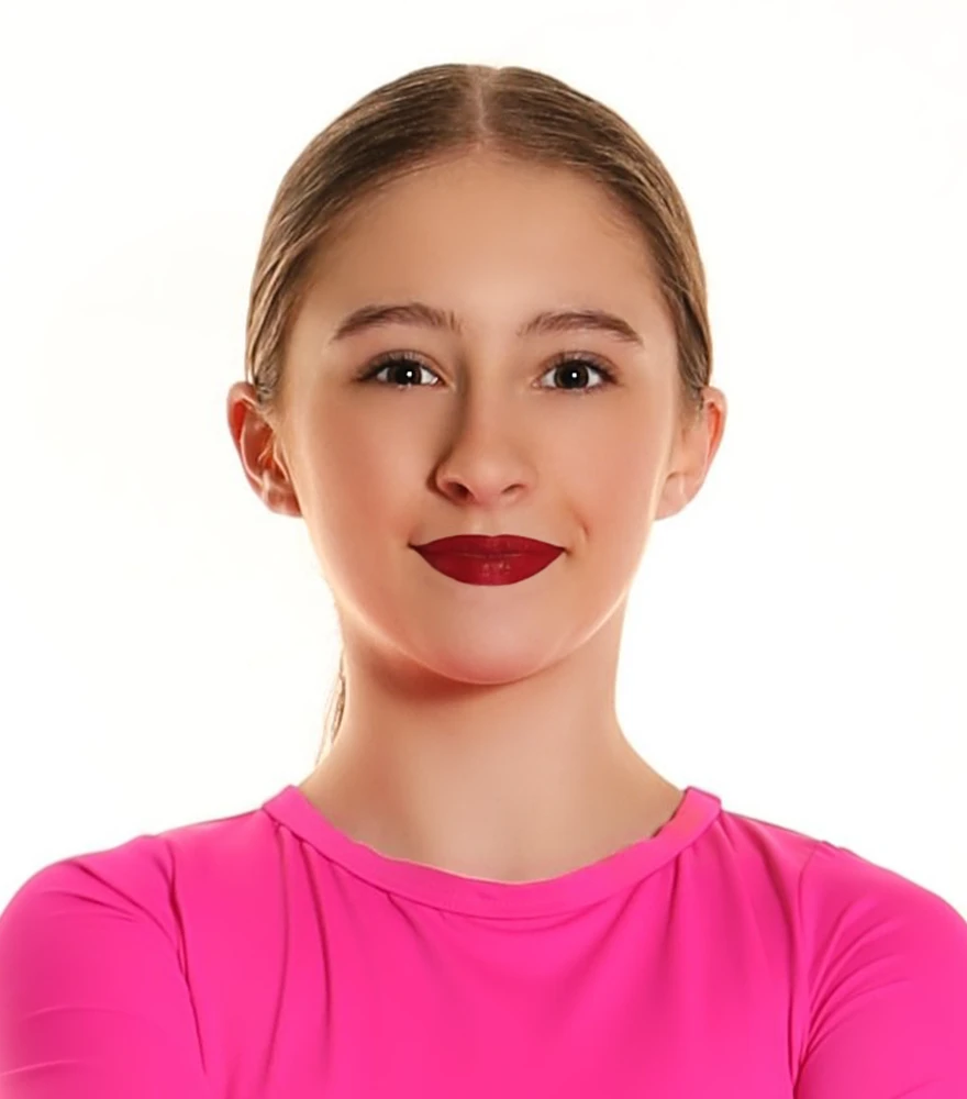 Retouched student portrait with enhanced skin tone and lighting.