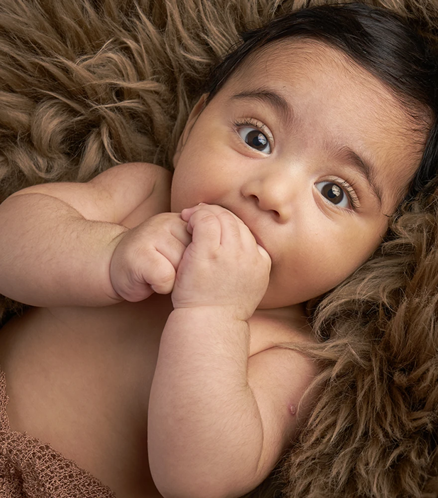 Unedited baby photo with natural lighting and visible texture.