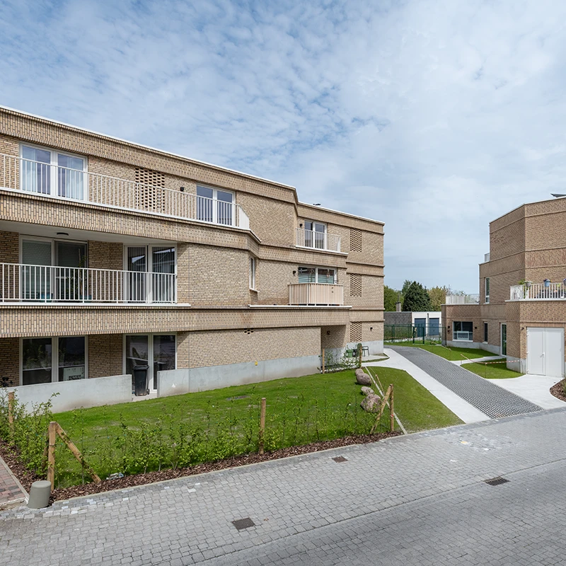 Original real estate photo showing fencing, trash bins, and unrefined details.