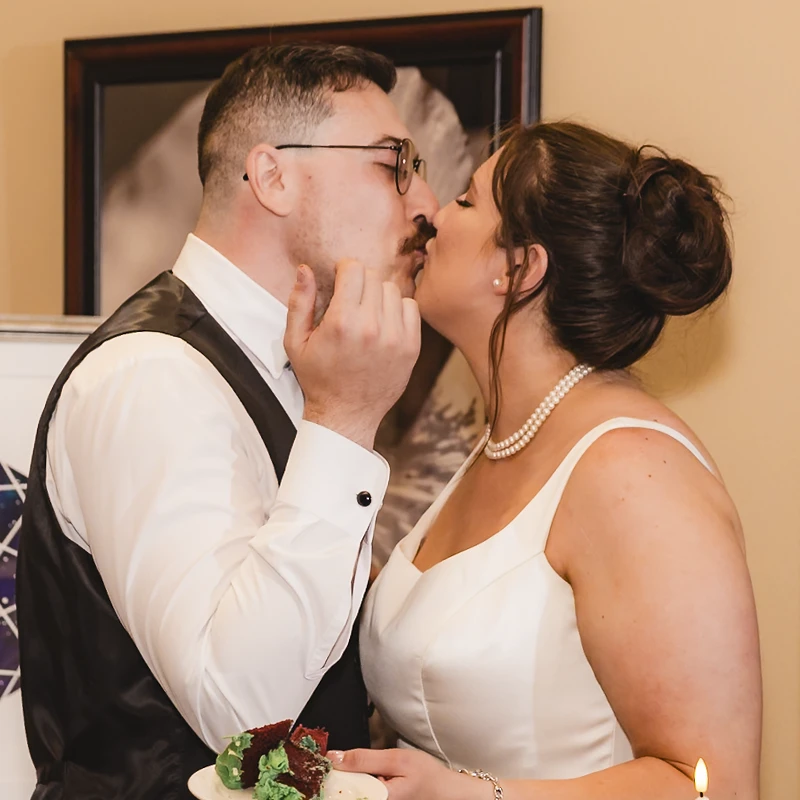 Unedited wedding photo showing bride and groom in natural indoor lighting.