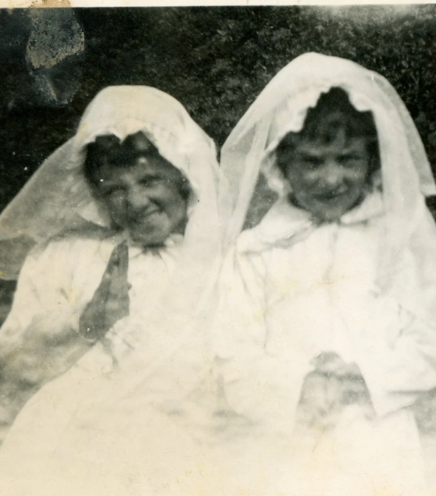 Black & White to Natural Colorization_Before Old black-and-white photo of two young girls in white veils, faded and partially damaged.
