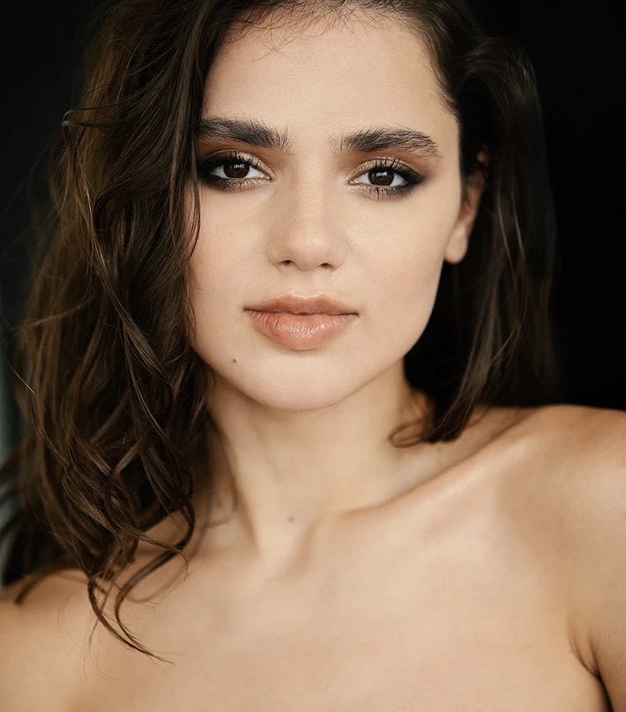 Edited portrait with warm skin tone, enhanced highlights, and cinematic color balance.