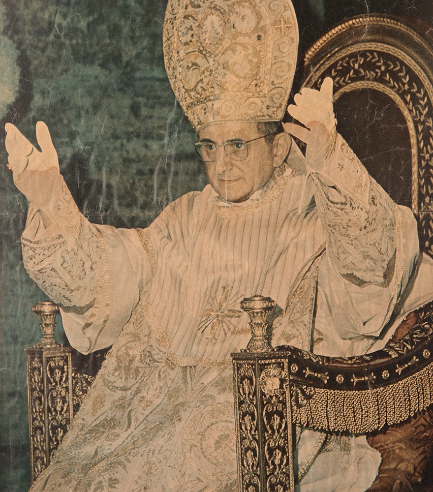 Color Restoration & Balancing_Before Old discolored photo of a religious figure in ornate robes, with visible fading and surface damage.