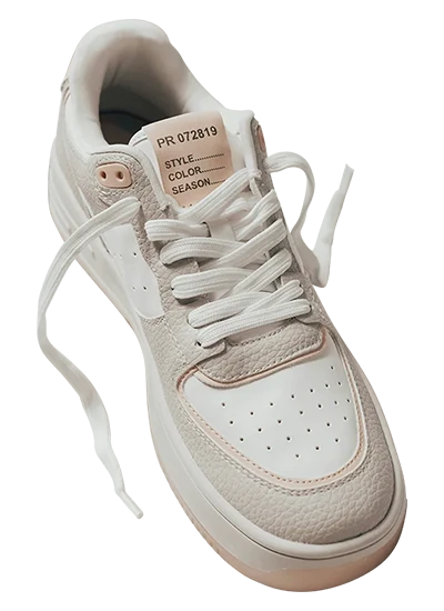  White and beige sneaker with soft textures and visible stitching.