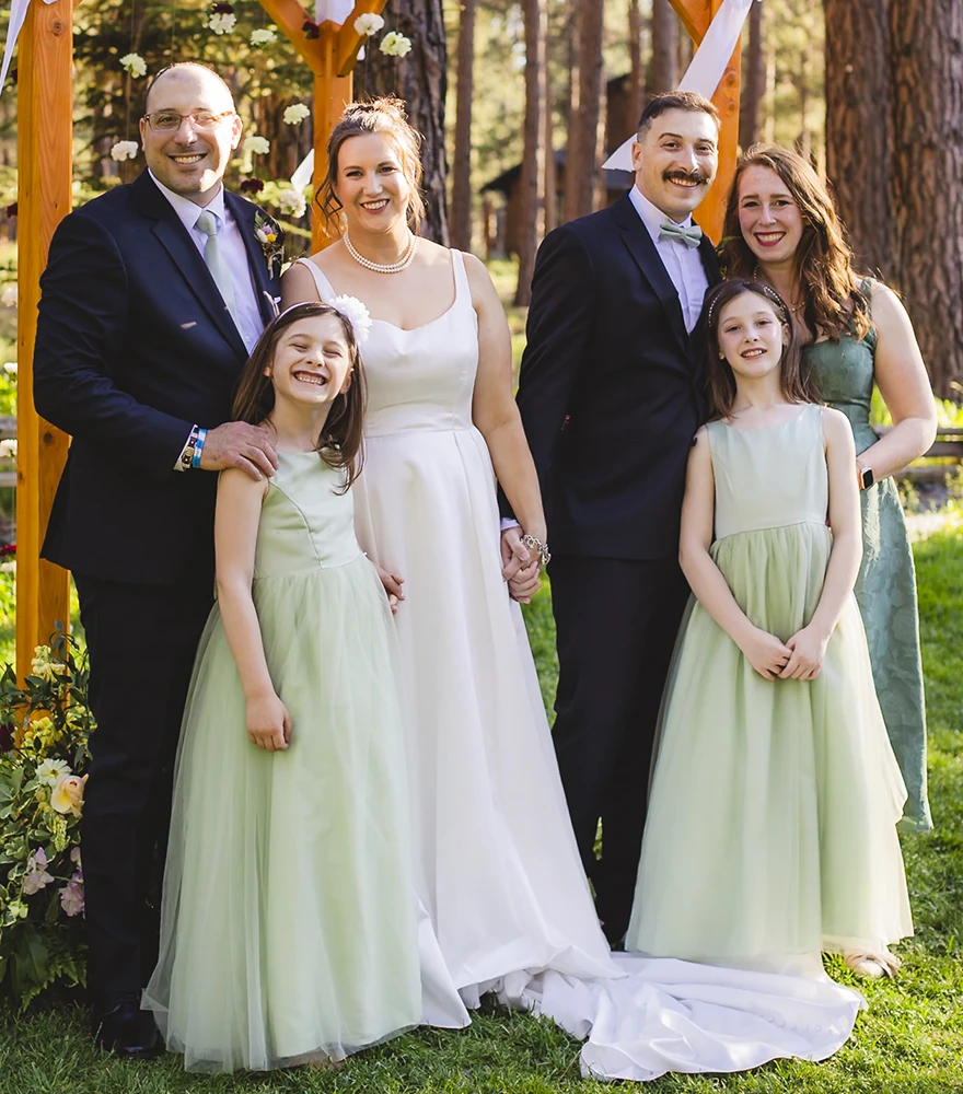 Original wedding family photo where one child's eyes are closed and unfocused.