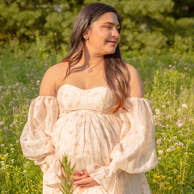 Fully retouched maternity image with improved clarity, softened shadows, and skin shine control.