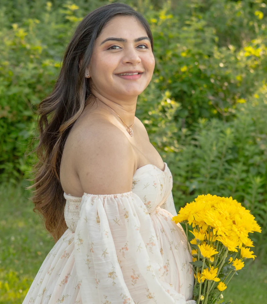 Raw maternity portrait with natural lighting, shadows, and unenhanced colors.