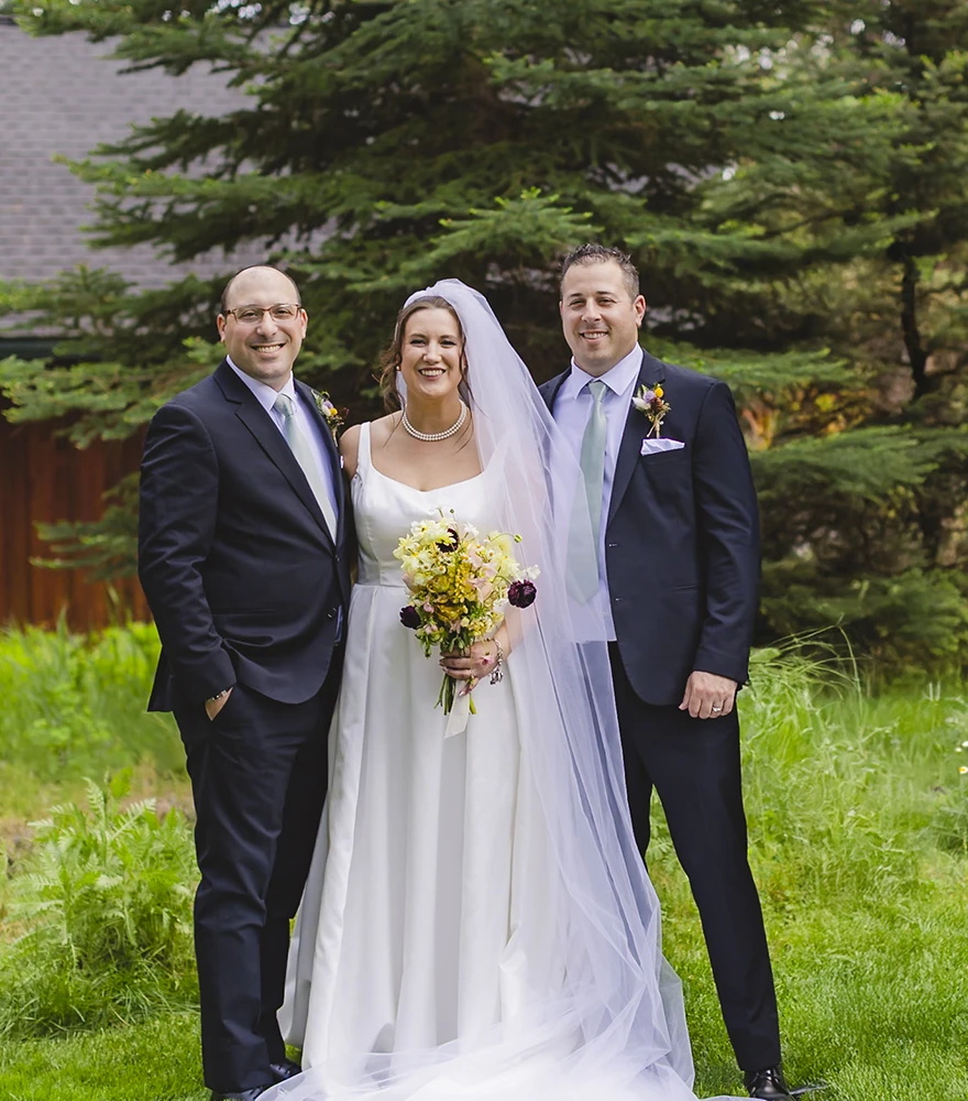 Edited wedding photo with an unwanted groomsman removed from the group.