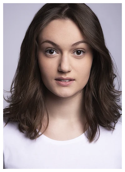 Young woman with natural makeup and smooth skin in a portrait pose.