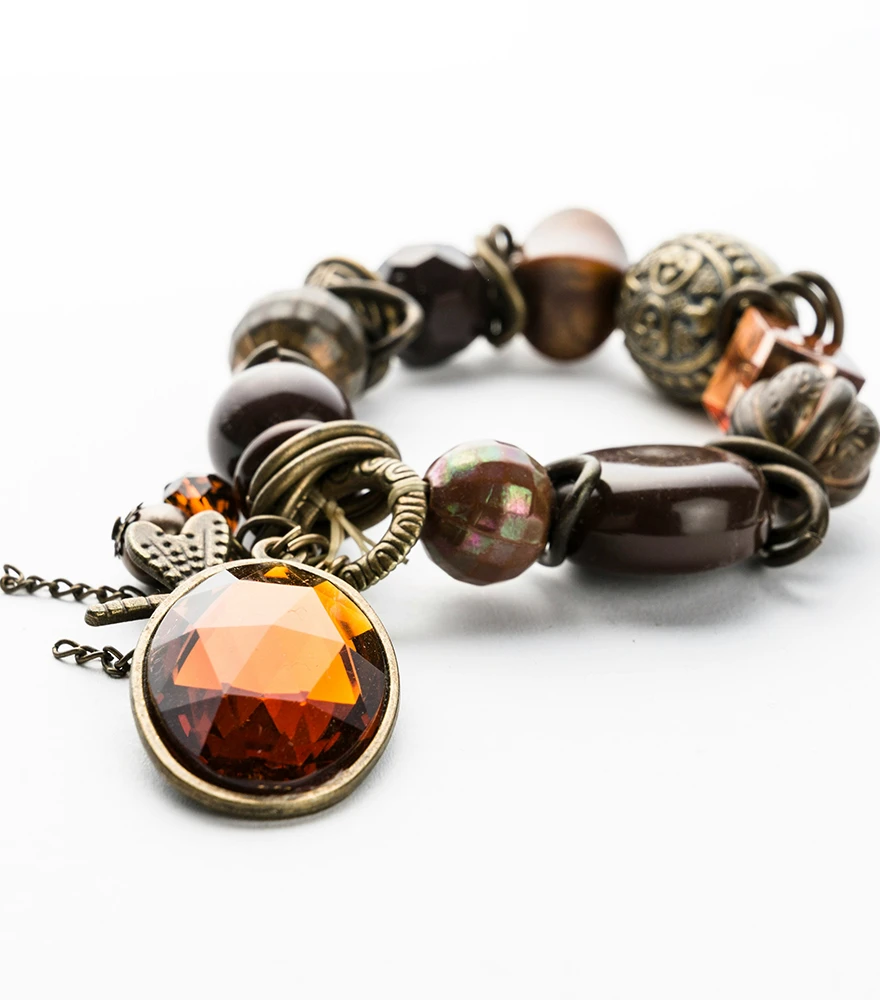 Bracelet placed on a white background with natural shadows and no editing.