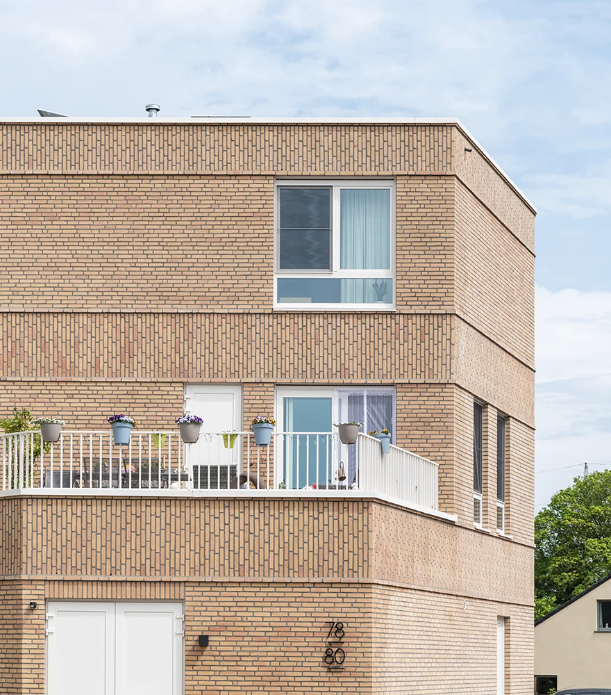 Building façade with dull, overcast sky making image appear flat.