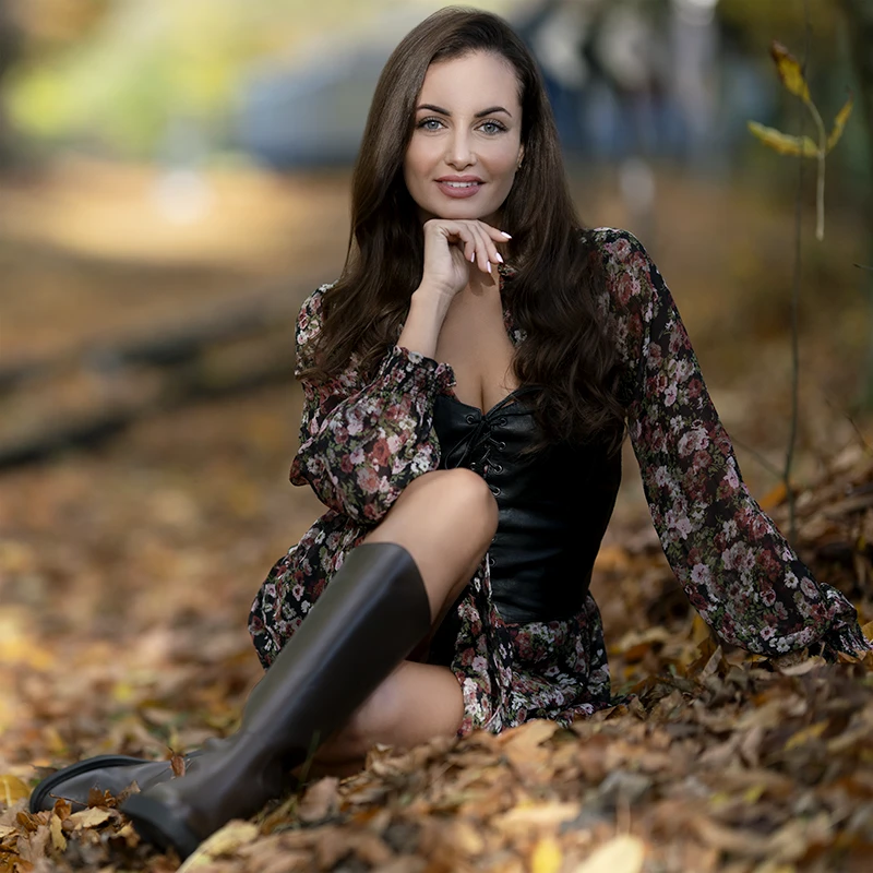 Enhanced portrait with richer fall colors, brighter subject, and vibrant lighting.