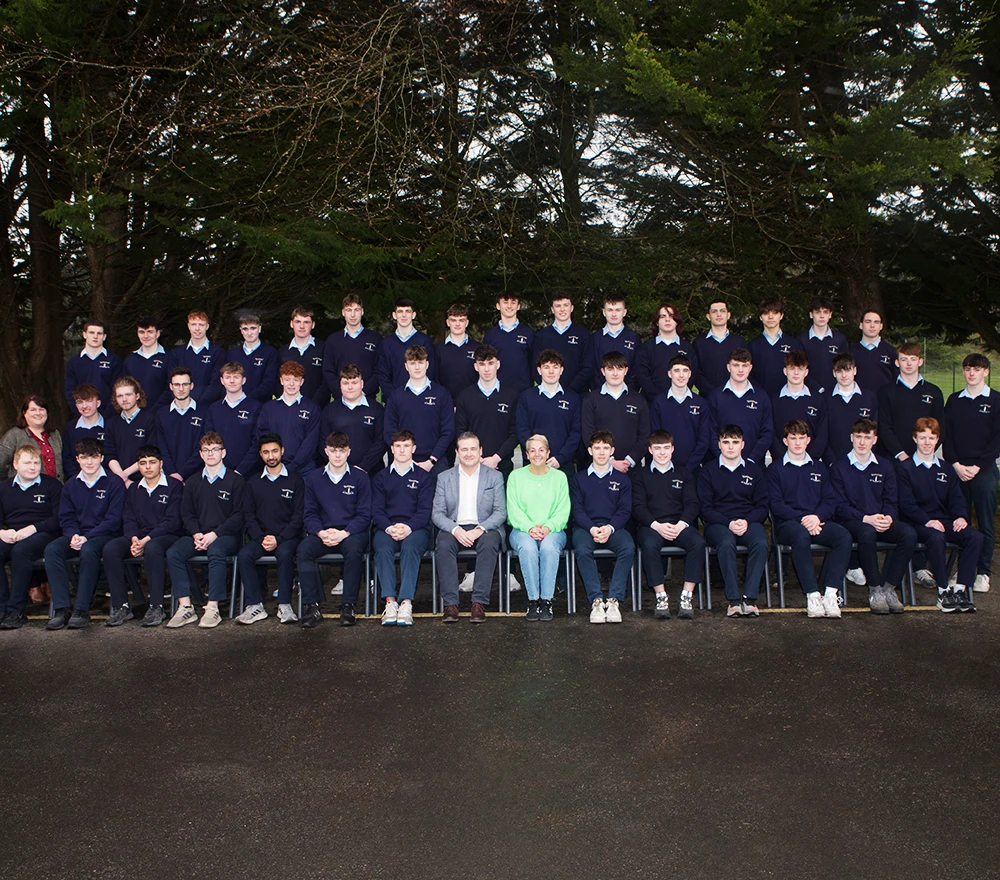 Restored class group photo with improved lighting, color correction, and sharp details.