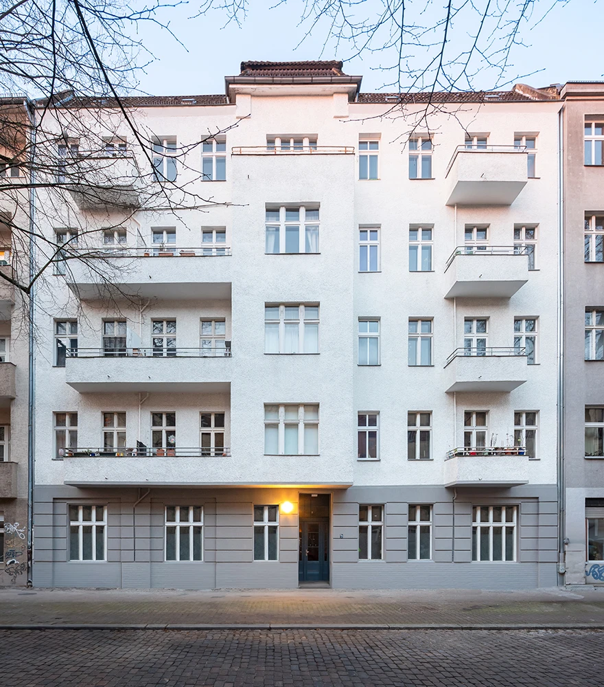 Apartment building front with windows and doors seamlessly closed and refined.