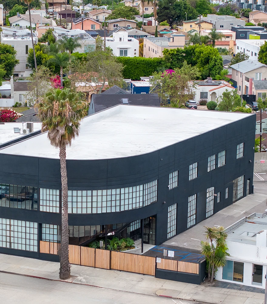 Commercial building exterior with all overhead wires and utility poles digitally removed.