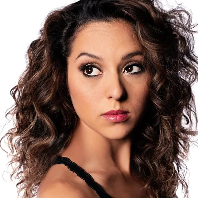 High-end beauty portrait of a woman with flawless skin, lighting, and detail enhancement.